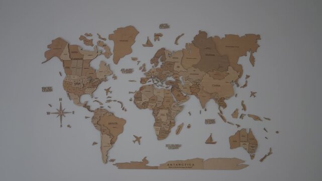 Wooden world map mounted on wall showing continents and country names