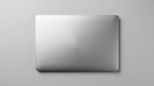 Minimalist overhead view of a closed, sleek silver laptop computer with a brushed metal finish, resting on a plain grey background, emphasizing modern design and portability., high resolution pr siyam