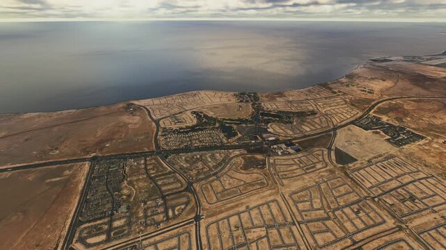 Circular aerial shot at sunrise of Mecca - King Abdullah Economic City. Saudi Arabia