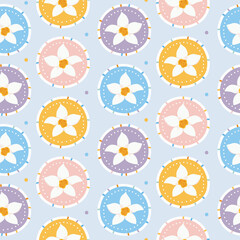 Pastel spring seamless pattern. White daffodil flowers in colorful medallions on blue background. Elegant floral texture for nursery wallpaper, baby textile, and gift wrap. Flat vector illustration