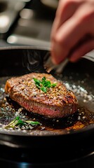 The chef hand-cooks the steak and adds seasonings using a freezing technique.