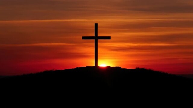 Silhouette of a wooden cross on a hill at sunset. Christian religious symbol of faith and sacrifice. Good Friday concept