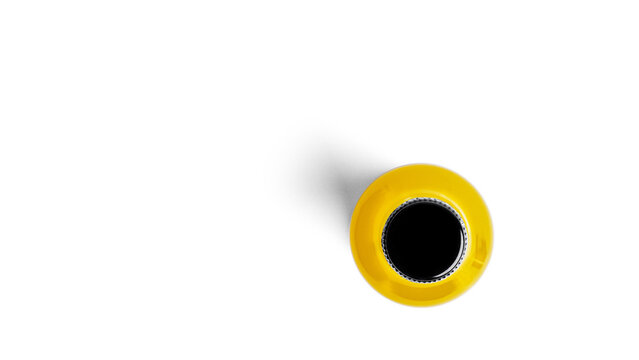 A bottle of yellow drink on a white background. High quality photo