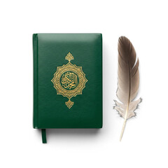 Miniature Quran book and a writing feather isolated on white background
