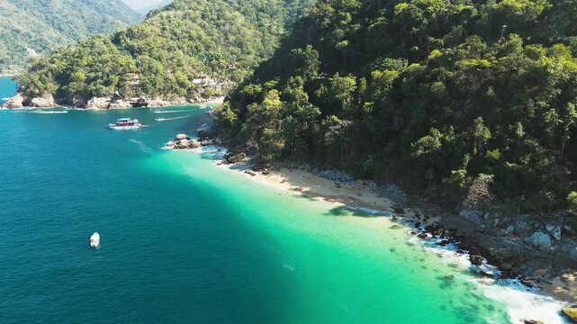 Aerial drone shot of beautiful madagascar beach with turquoise water in puerto vallarta, mexico