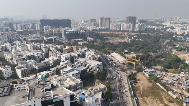 An aerial view of Hitex Road, Hyderabad automobiles leaving a commercial hub's intersection signal it is the capital of southern India's Telangana state. Center for the technology industry.
