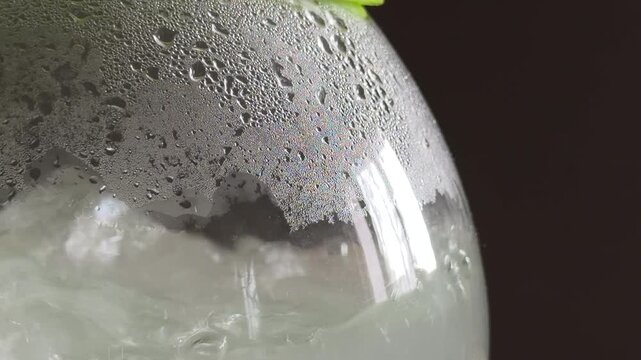 A green electric kettle boils water vigorously until it reaches its peak temperature. This process creates a steady humming sound followed by a sharp click as the automatic switch turns off.