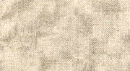 Fototapeta premium A close-up view of a textured beige fabric with subtle woven pattern