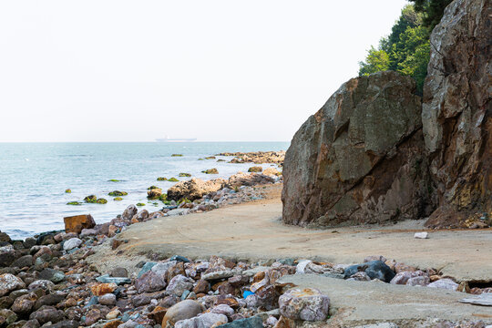 Coastal path beside rocky shoreline