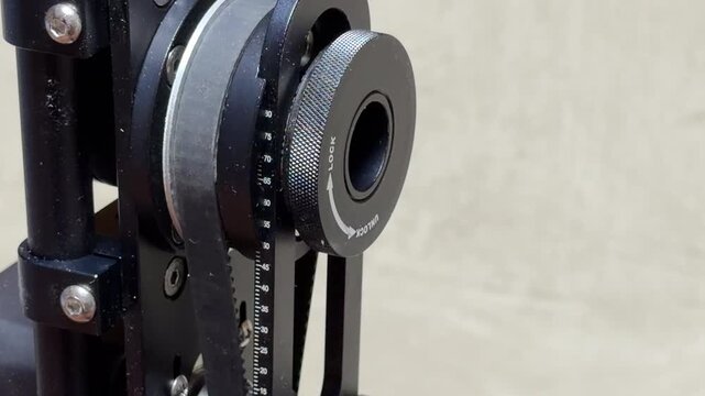 The motorized camera gimbal rotates its internal belt-driven assembly with robotic precision. This smooth mechanical action produces consistent, high-pitched technical whir and a faint electronic hum.
