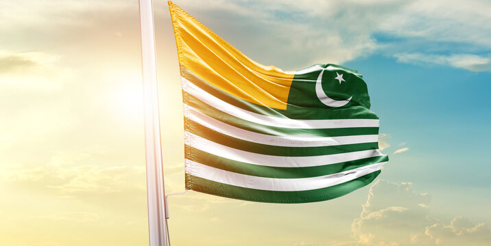 Kashmir national flag waves on soft sky.