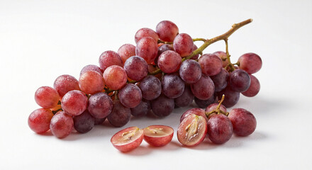 Bunch of Red Grapes With Water Droplets and Sliced Grape on White Background.