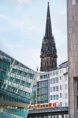 Fototapeta premium Hamburg, Germany - city center with all the sights on the shore with a view of train. Contrast between modern and old architecture.