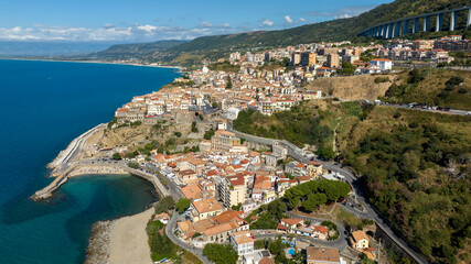 Fototapeta premium Aerial view of the city of Pizzo Calabro, located on the Coast of the Gods, in the province of Vibo Valentia, Calabria, Southern Italy. The town's historic center overlooks the Mediterranean Sea.