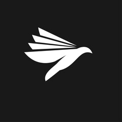Obraz premium Stylized White Bird in Flight Logo Design on Black Background