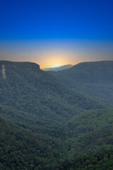 Fototapeta premium Beautiful flowing River in Fitzroy water Falls in Bowral NSW Australia beautiful colourful cloudy skies lovely waterfalls