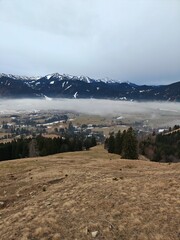 mountain landscape with snow and clouds