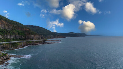 Sea Cliff Bridge on the southern coast of Sydney with sweeping Ocean Views and Mountain terrain. a major Bridge Road on the beautiful Australian coastline 