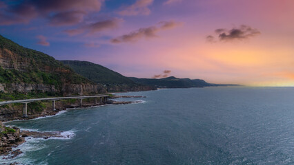 Sea Cliff Bridge on the southern coast of Sydney with sweeping Ocean Views and Mountain terrain. a major Bridge Road on the beautiful Australian coastline 
