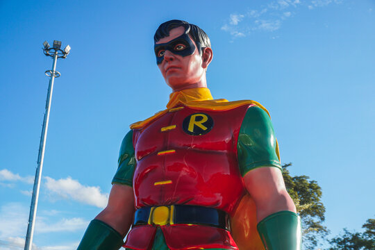 a Robin statue at the traditional market of Tangga Arung, Tenggarong with blue sky