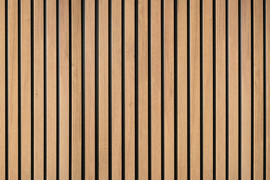 Wood lath panels creating vertical timber texture pattern