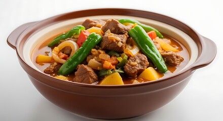 Fototapeta premium Hearty beef stew with vegetables in a brown ceramic bowl on a white background savory dish with chunks of meat and green beans