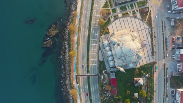 Aerial View of Sarayburnu Mosque in Giresun, Turkey; Ottoman-Style Architecture by the Black Sea Coast with Coastal Highway, Drone Footage.