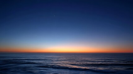 Obraz premium A tranquil twilight gradient sky over the ocean horizon with a single distant star