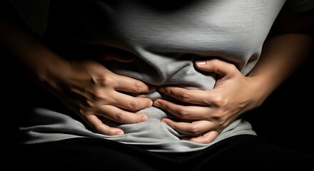 Woman suffering severe stomach pain and cramps due to diarrhoea illness