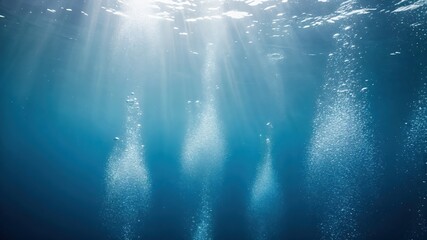 Fototapeta premium Underwater Air Bubbles Rising to Surface with Sunbeams, Deep Blue Ocean Scuba Diving Background