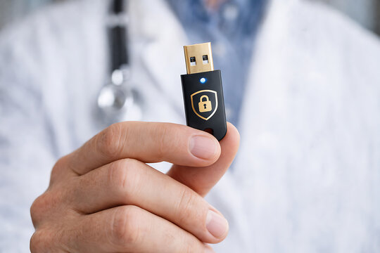 USB Security Key in Hand Twofactor Authentication Concept for Healthcare IT Data Protection Compliance and Clinical Access Control