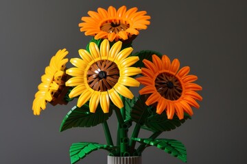 Fototapeta premium 200 LEGO bricks forming yellow and orange sunflowers in a vase with green leaves in LEGO style