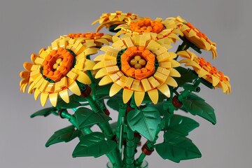 Fototapeta premium 200 LEGO bricks forming yellow and orange sunflowers in a vase with green leaves in LEGO style