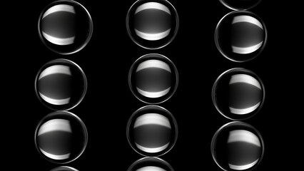 Realistic Clear Glass Bubbles or Spheres Floating in Three Columns on Black Background