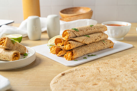 Homemade mexican food. Tortilla rolled chicken taquitos