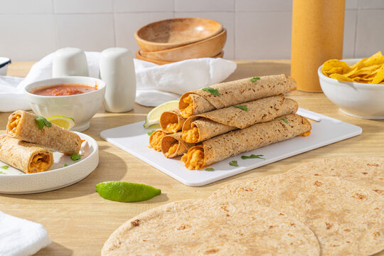 Homemade mexican food. Tortilla rolled chicken taquitos
