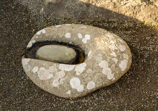 A trough quern and rubbing stone, used for grinding corn in the Neolithic and Bronze ages, approx 2500-800 BCE covering the Neolithic, Bronze and Iron ages