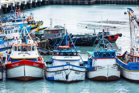 Colorful wooden fishing boats in the port of Callao, Peru. 