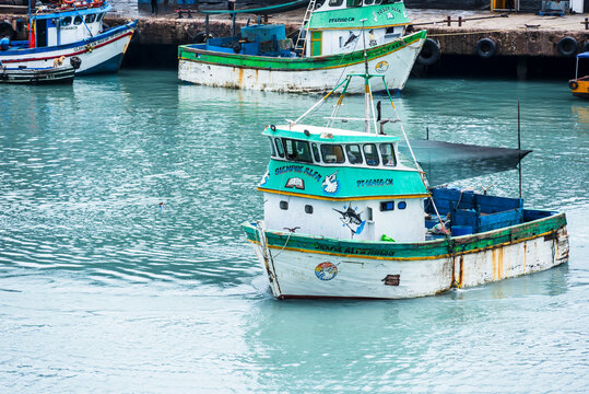 Colorful wooden fishing boats in the port of Callao, Peru. 