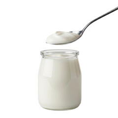 Yogurt in a glass jar with a spoon