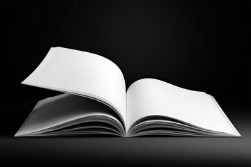 An open book with blank white pages, one page subtly turning, against a dark background