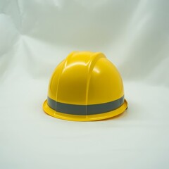 Fototapeta premium Yellow hard hat with gray band safety helmet industrial