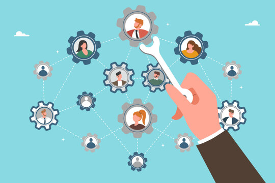 Concept of leadership, team management, staff reorganization, workflow optimization and improving business performance, workforce distribution. Hand with wrench improves the organizational structure.