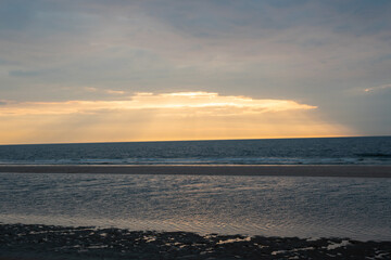 Beautiful sea, sky, sand on the beach. Alone by the sea at sunset.