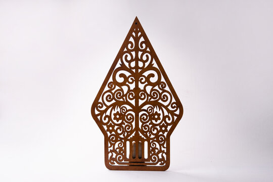 Iconic Gunungan silhouette in warm tones. Symbolizes the universe in puppet theater. A sophisticated cultural piece for living room accents or gallery displays.