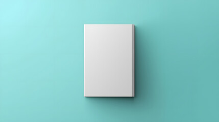 Fototapeta premium Top View of Blank White Vertical Book Cover Mockup on Solid Teal Background