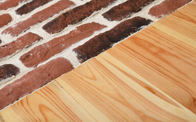 The floor is made of light boards and old brickwork.