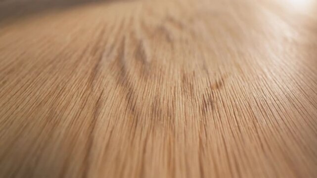 Closeup of a wooden floor with a blurred background and warm lighting. 4k Footage Video