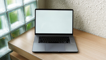 Modern Space Gray MacBook Pro Mockup on Minimalist Wooden Desk with Blank Screen
