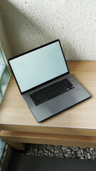 Modern Space Gray MacBook Pro Mockup on Minimalist Wooden Desk with Blank Screen